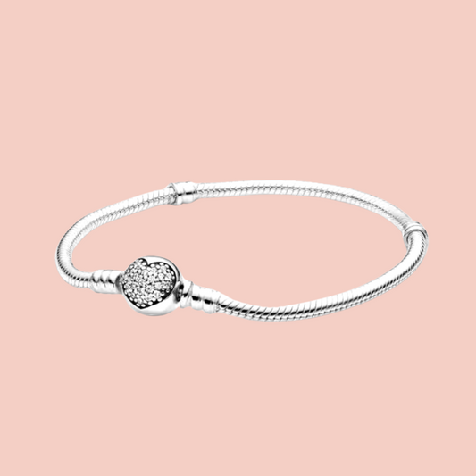 Pulsera broche redondo con corazón de piedras plata