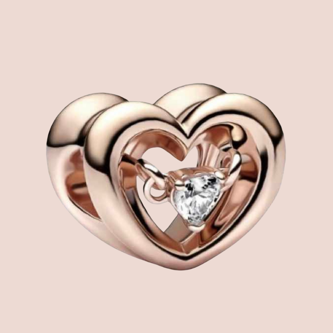 Charm corazón oro rosa con piedra plata en el centro