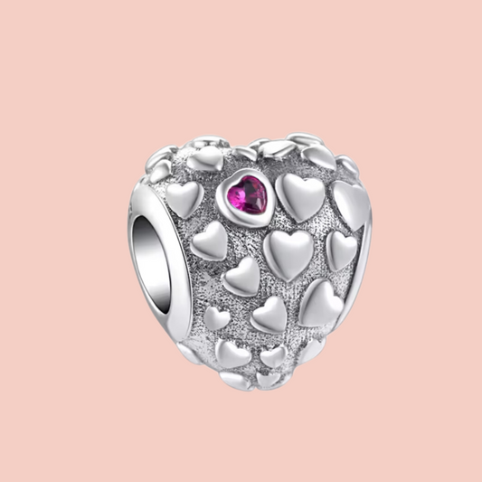 Charm corazón plata con corazones pequeños plata y un corazón rojo