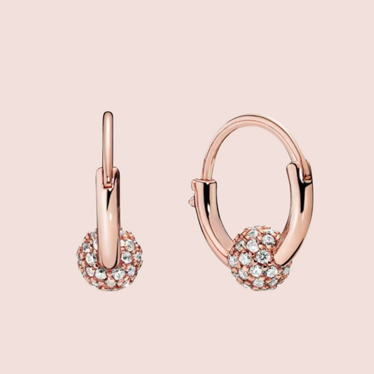 Arracadas pequeñas oro rosa con piedras al centro