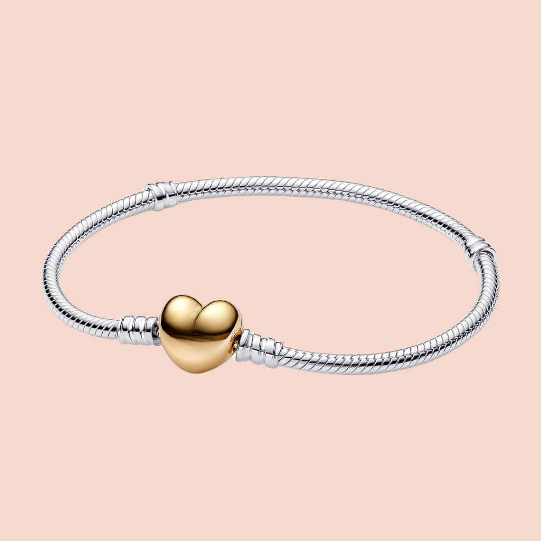 Pulsera plata con corazón dorado