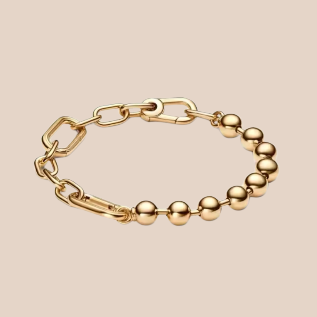 Pulsera dorada con eslabones y bolitas