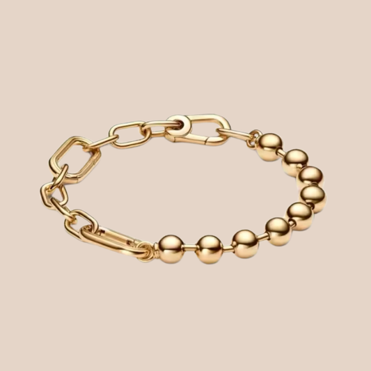 Pulsera dorada con eslabones y bolitas
