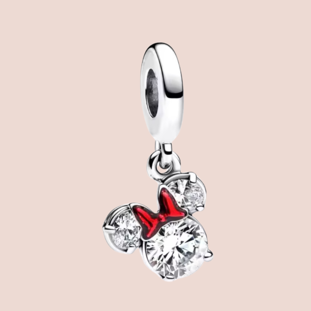 Charm cara de Minnie con piedras plata y moño rojo